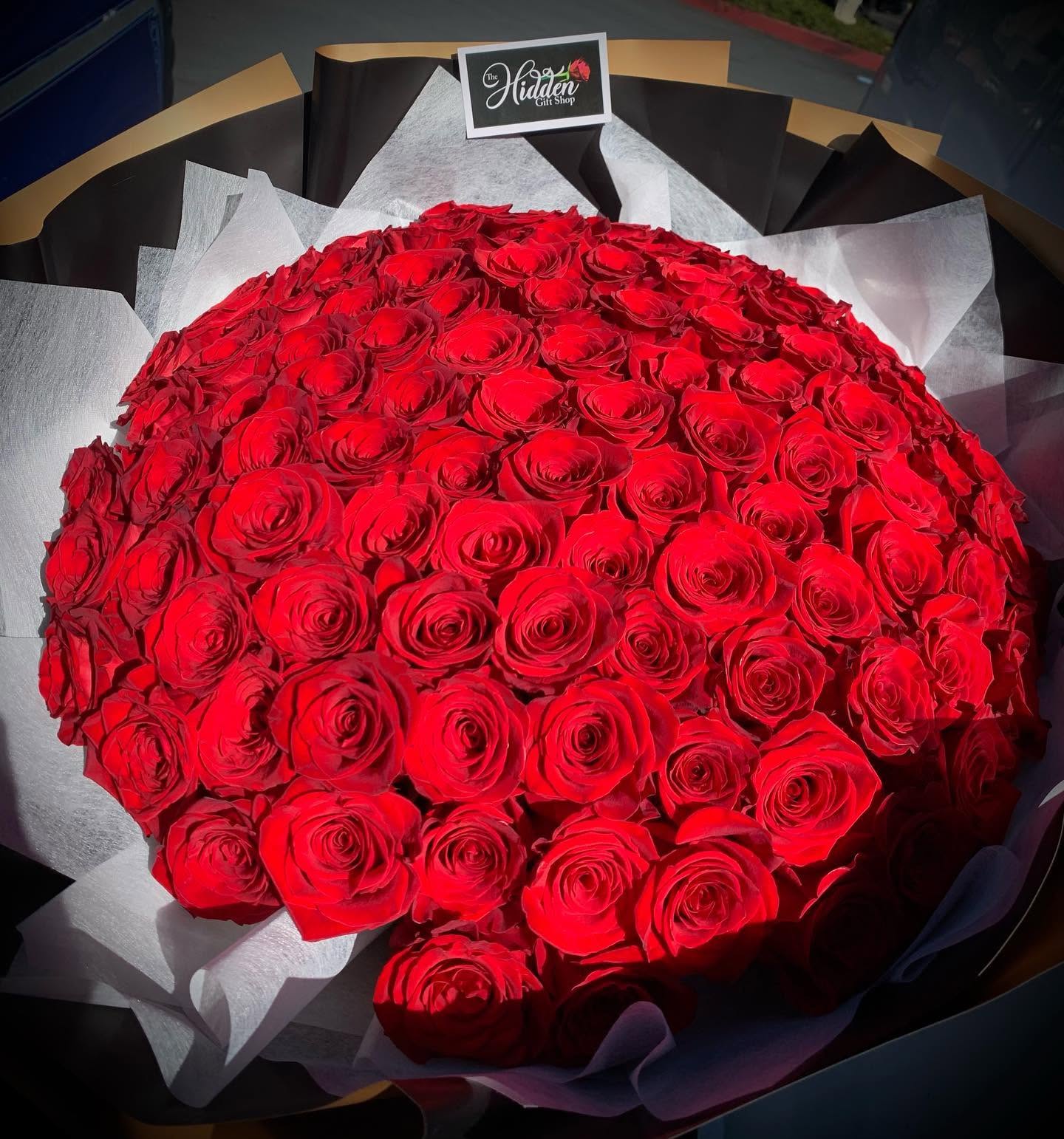 Extra large red rose bouquet with elegant black and white wrapping from The Hidden Gift Store
