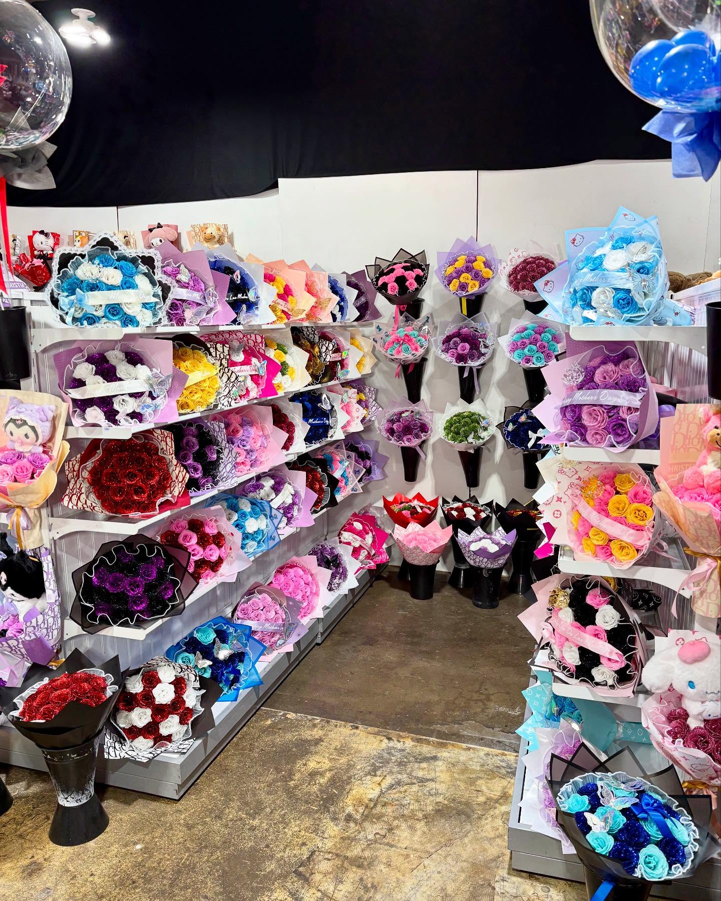 Colorful rose bouquets and custom floral arrangements displayed inside The Hidden Gift Store