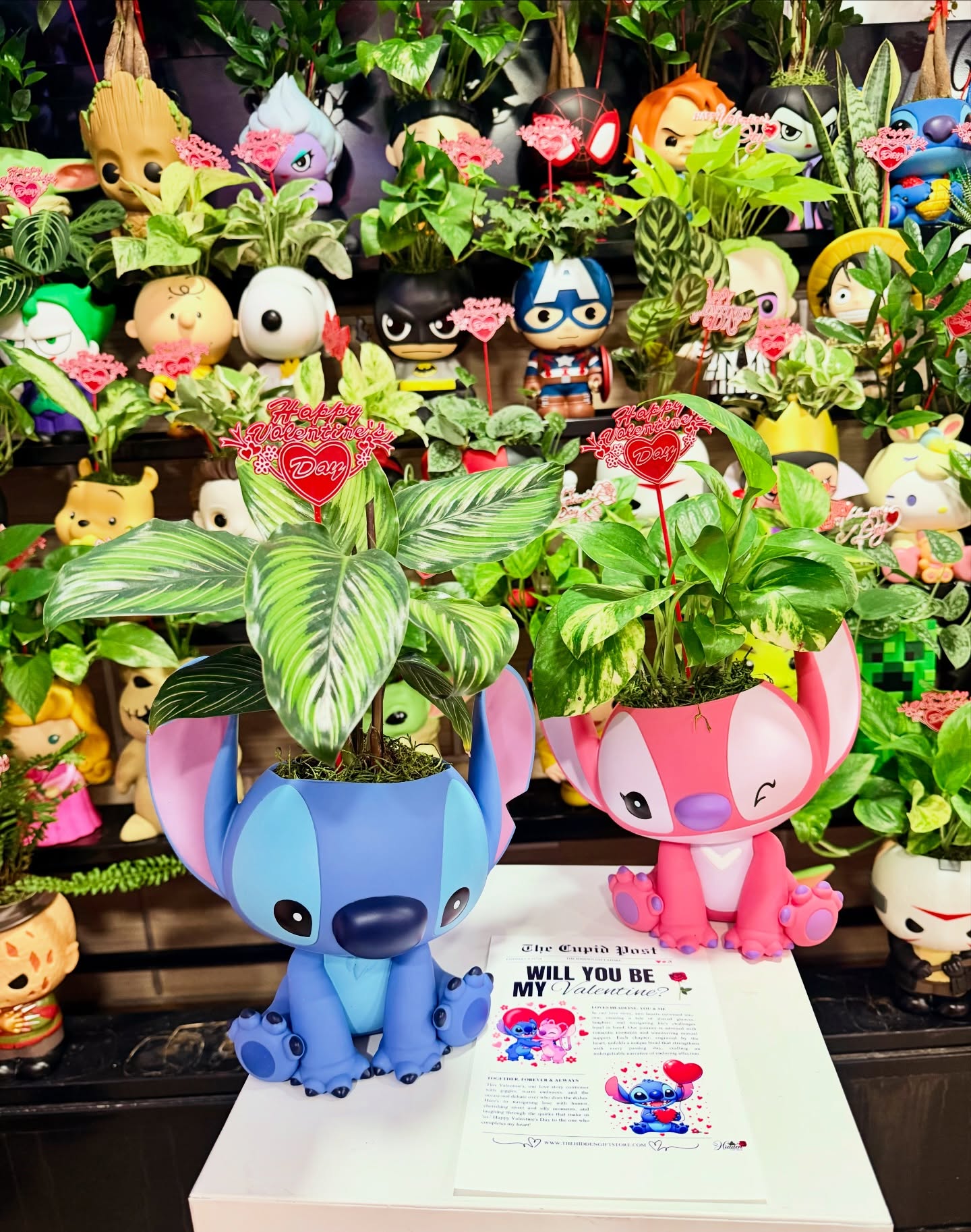 Valentine’s Day character planters with green plants and romantic gift decorations at The Hidden Gift Store