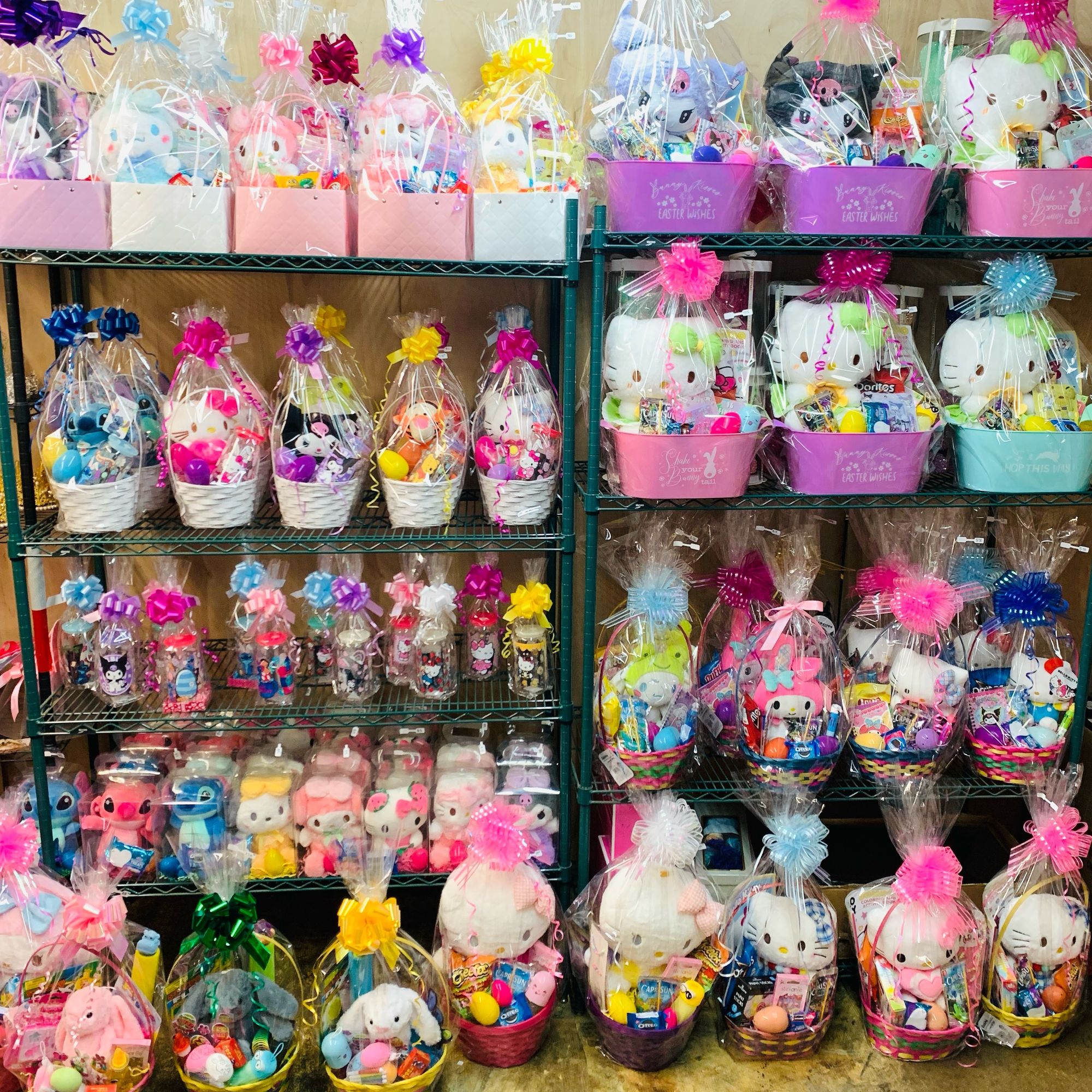 Easter gift baskets filled with character plush toys, candy, colorful eggs, and festive bows.