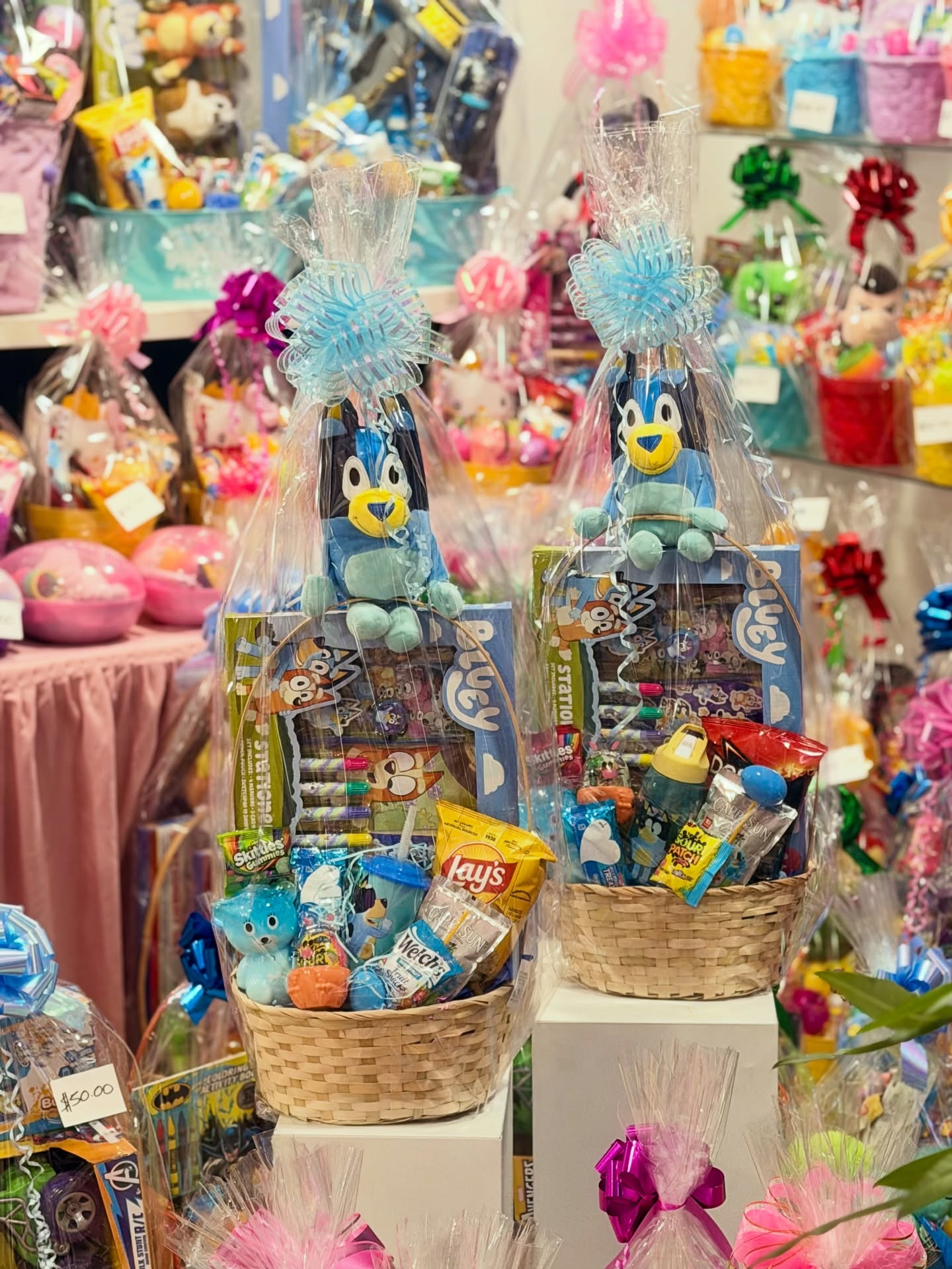 Bluey-themed gift baskets filled with toys, candy, snacks, and children’s gifts